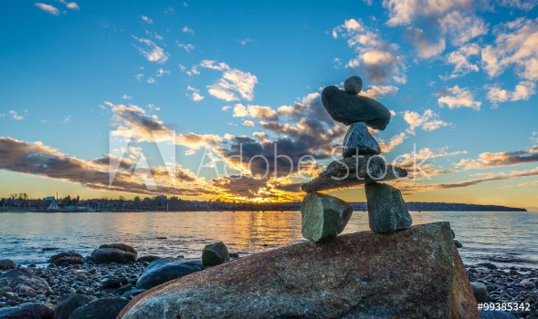 Picture of inukshuk in the sunset on the beach